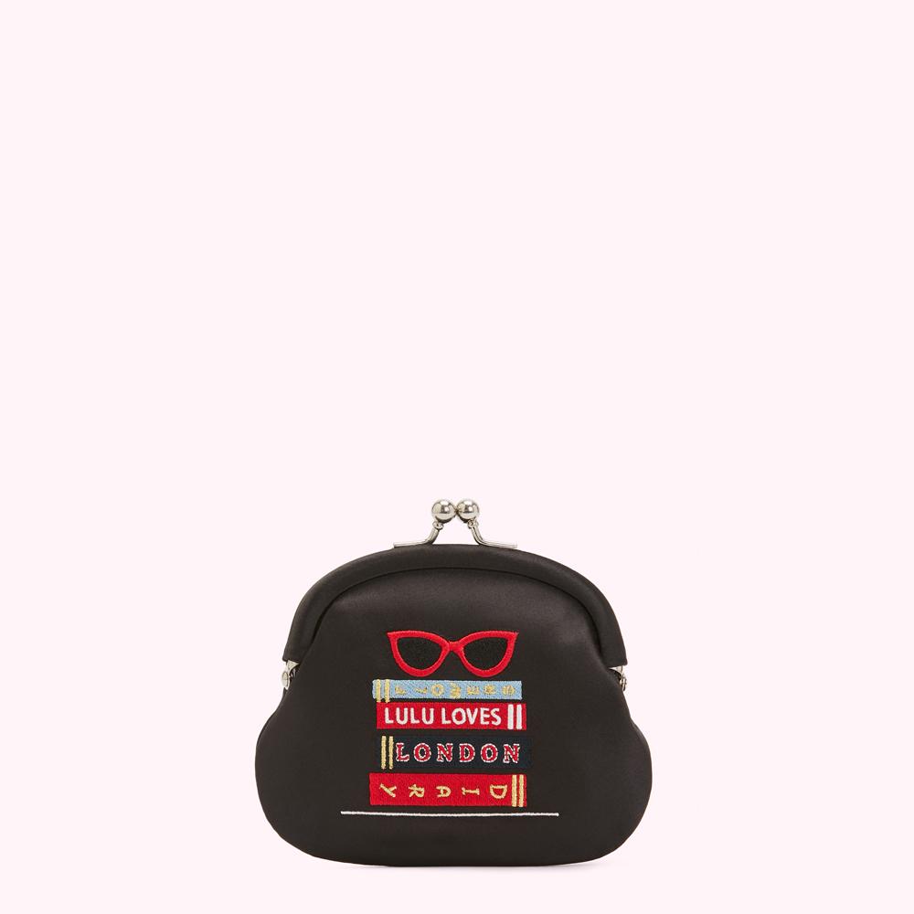 Black satin purse with embroidered glasses and books; text reads "Lulu Loves London".