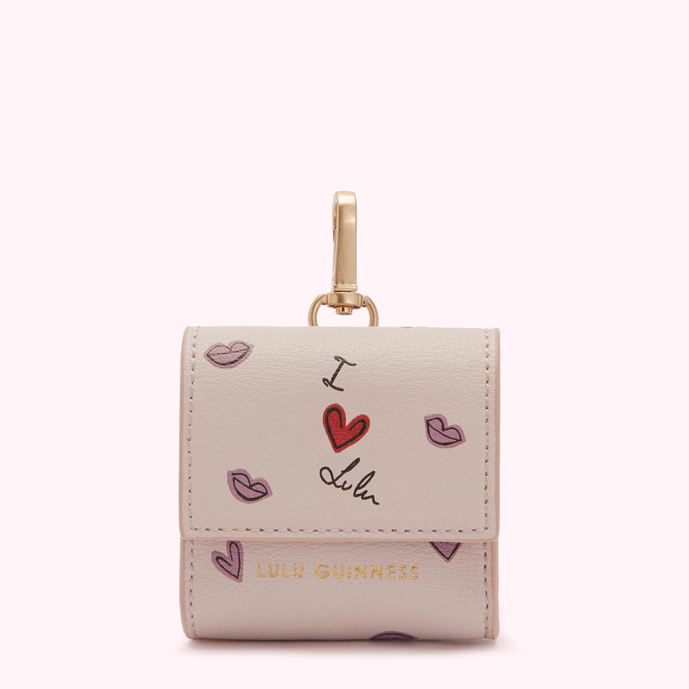 Light pink Lulu Guinness Air pods case with gold clasp, adorned with a "I love Lulu" design and pink lip prints.