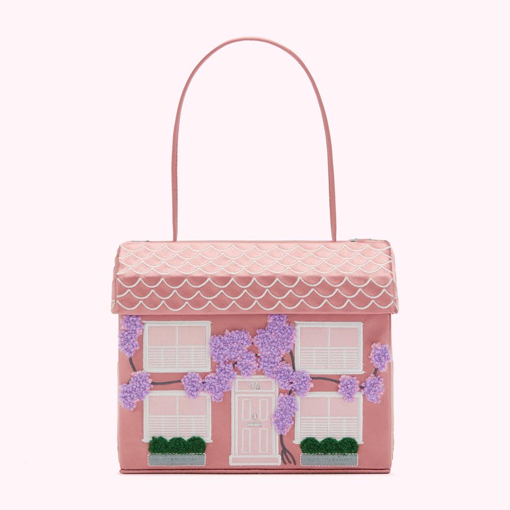 Pink house-shaped handbag with lavender wisteria embroidery.