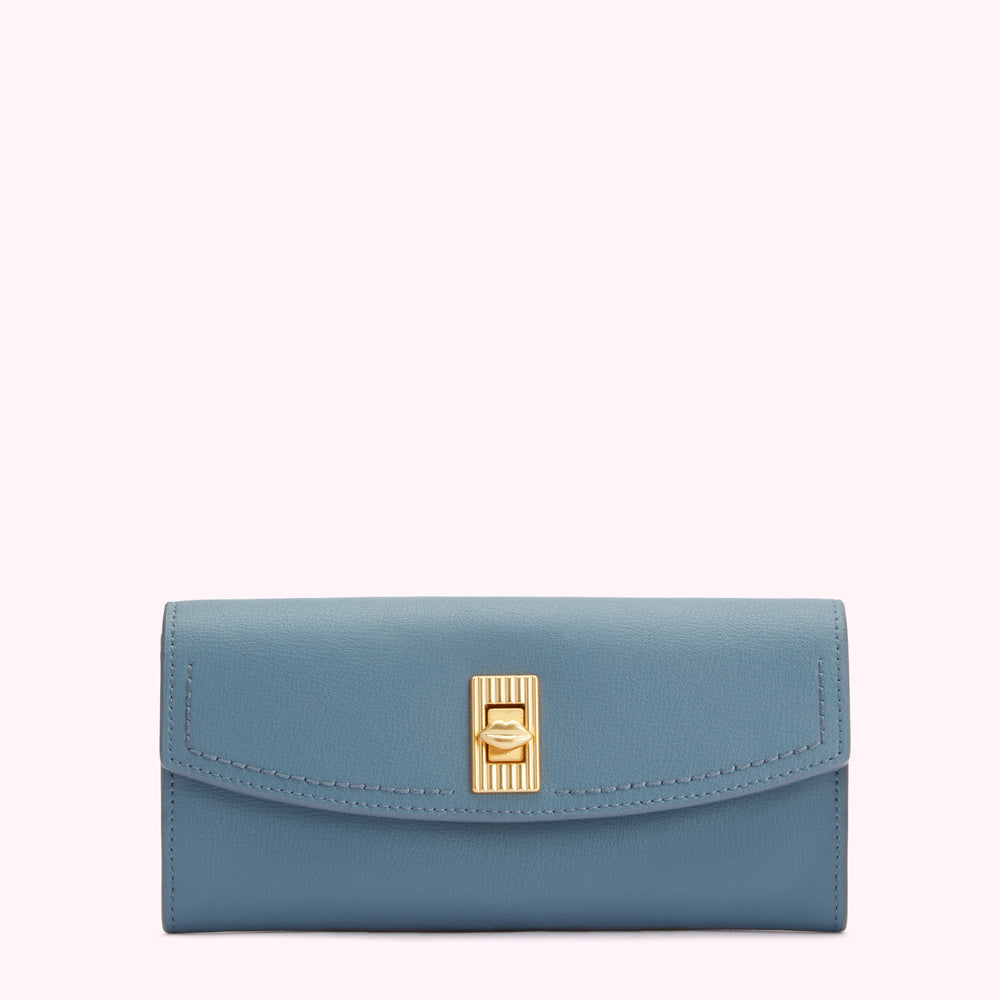 A dusty blue leather wallet with a gold lip-shaped clasp against a white background.