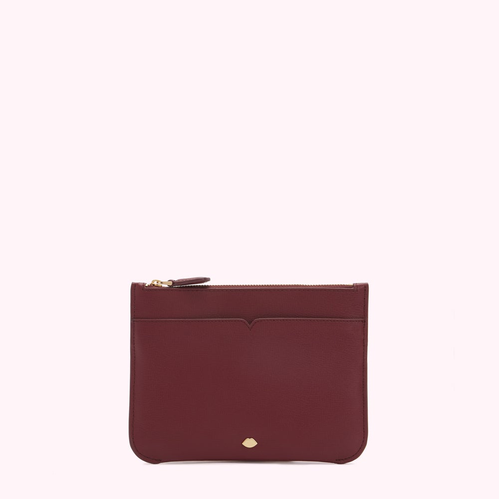 Burgundy leather zip pouch on white background.