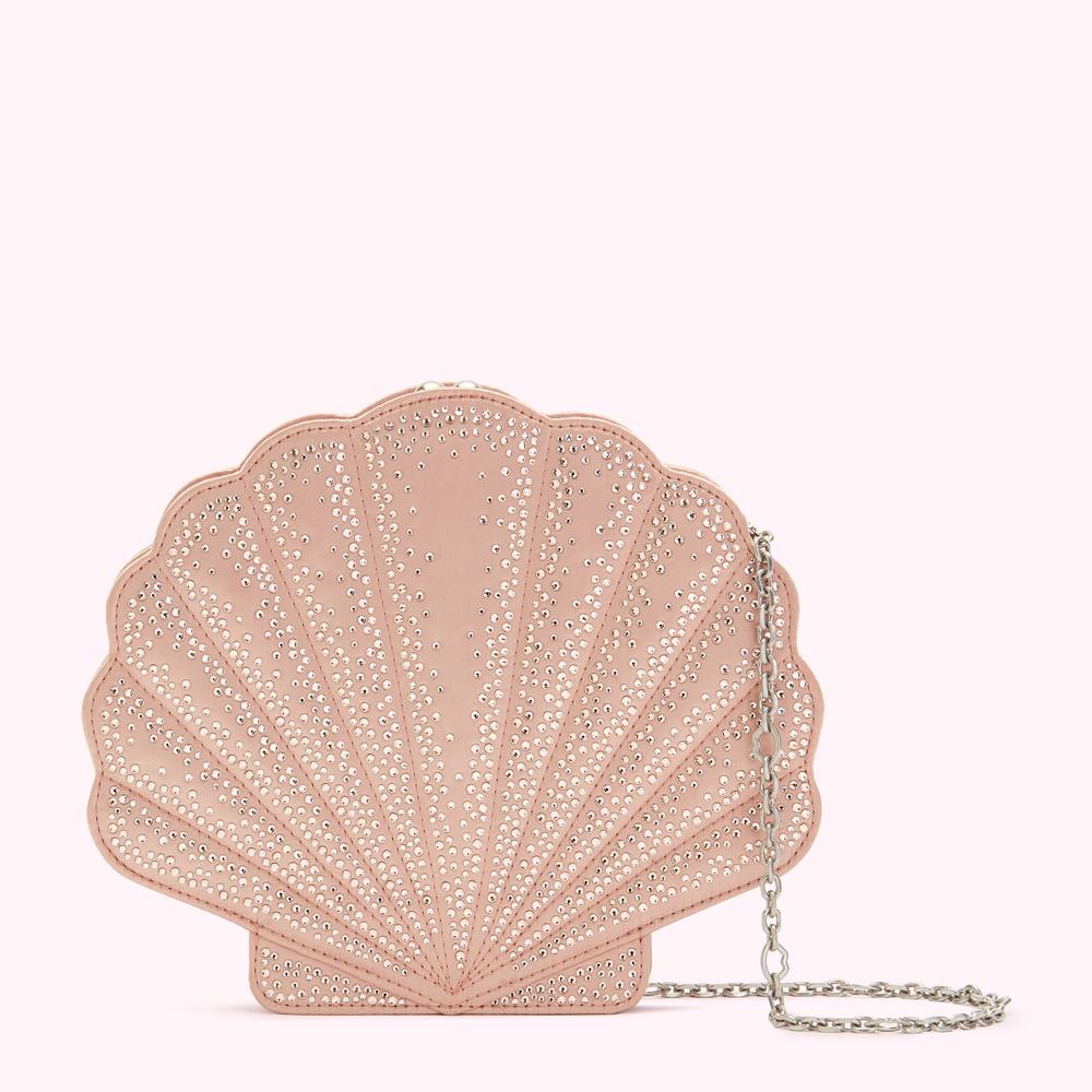 Pink seashell-shaped clutch embellished with crystals and a silver chain strap.