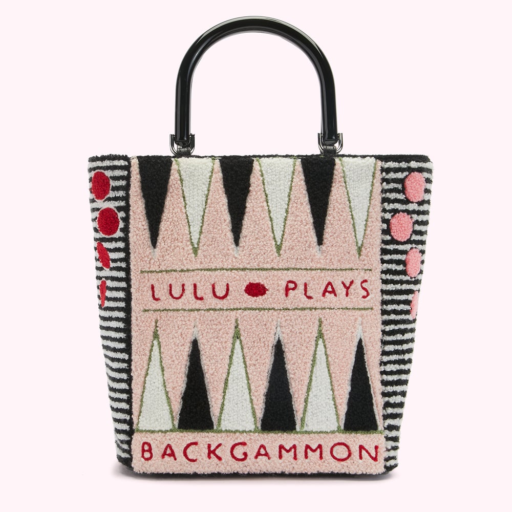 Pink and black backgammon-themed tote bag with black handles. The text "Lulu Plays Backgammon" is embroidered on the bag.