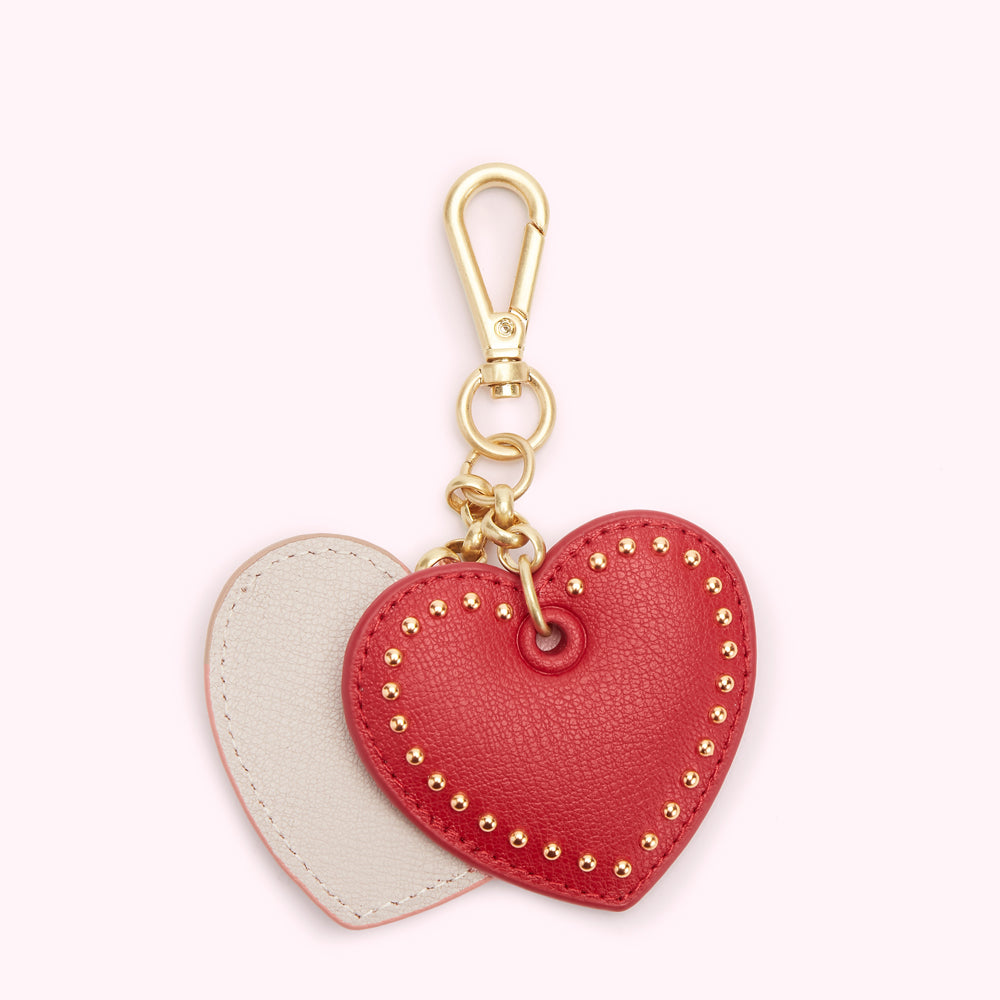 Red and beige leather heart-shaped keychain with gold-toned hardware.