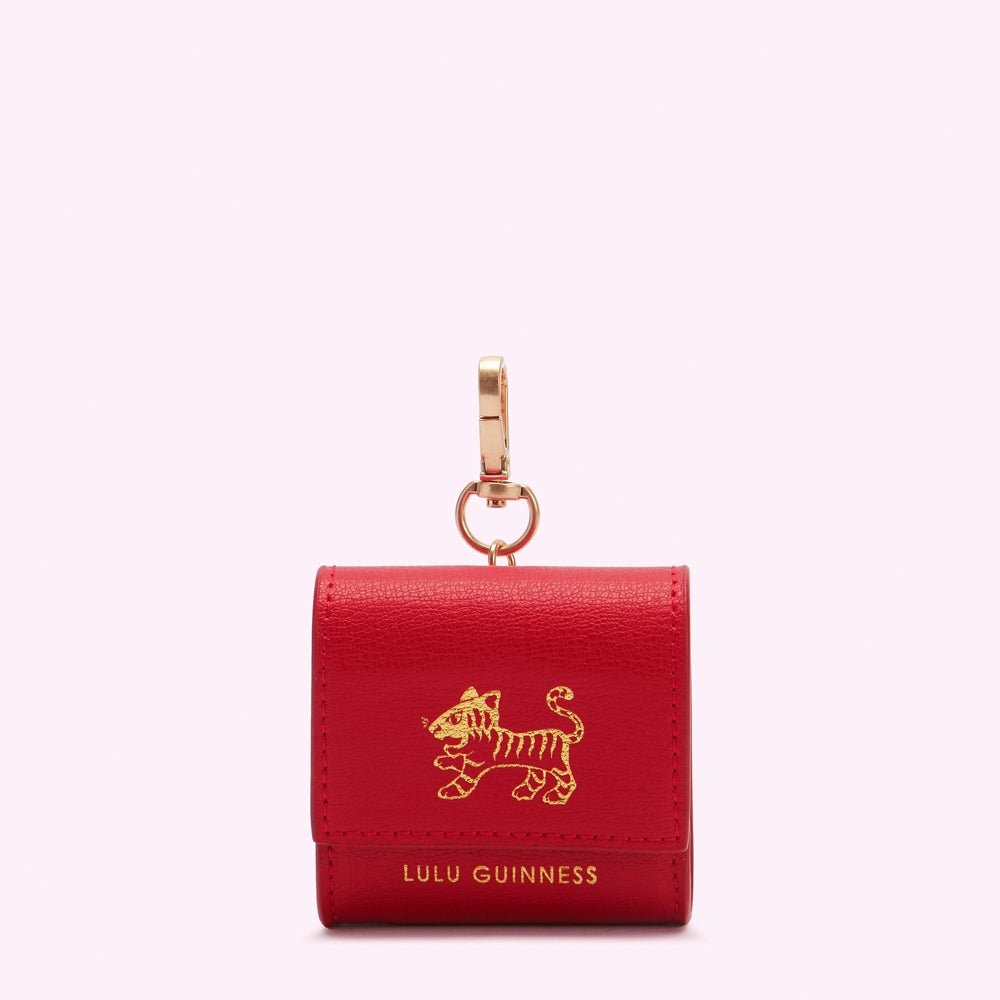 Red leather Lulu Guinness Air pod holder with gold tiger emblem and clasp.