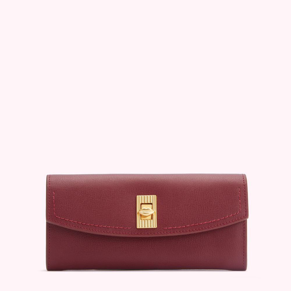 Burgundy leather wallet with gold clasp.