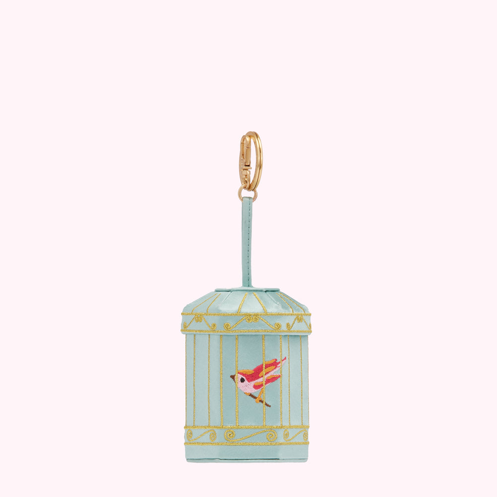 Light teal birdcage-shaped keychain with a gold clasp and a small red and yellow bird inside.