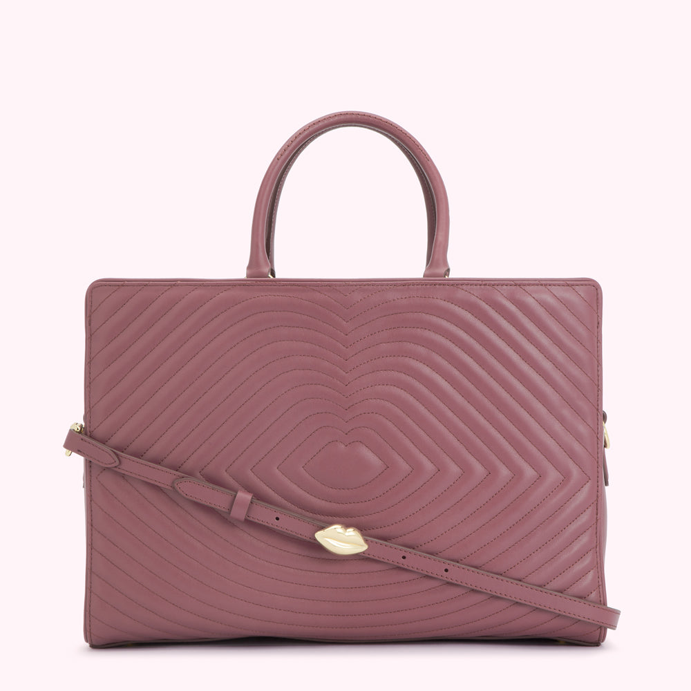 Dusty rose quilted leather handbag with gold lip detail.
