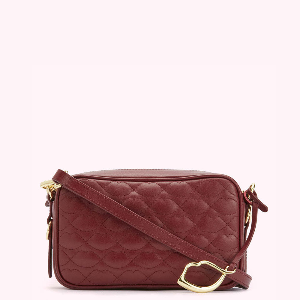 Burgundy quilted crossbody bag with gold-tone hardware.