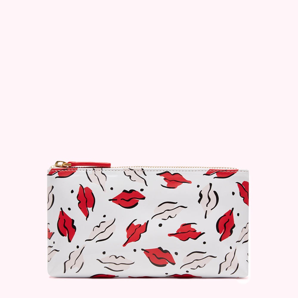 White pencil case with red lips print and red zipper.