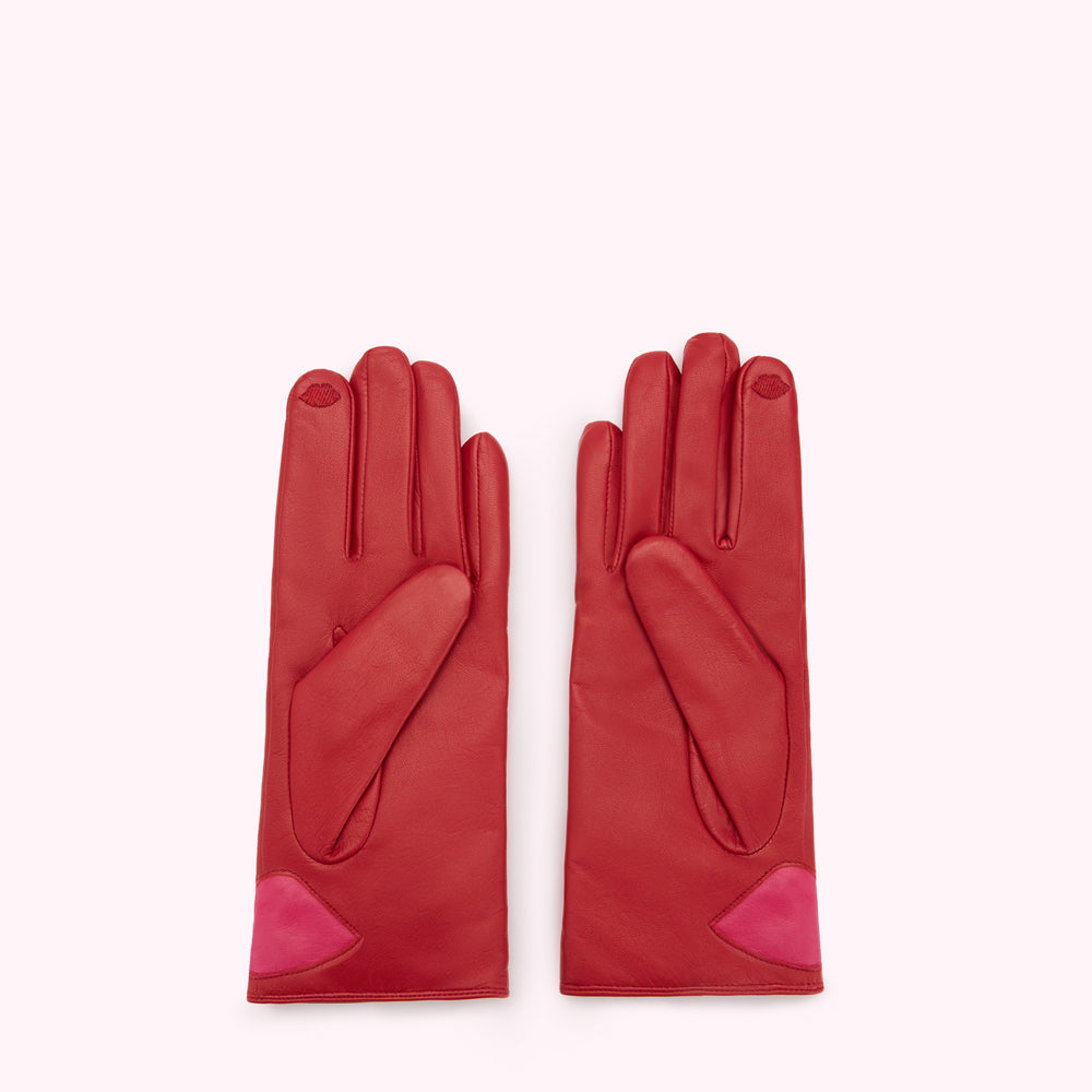 Pair of red leather gloves with pink accents.
