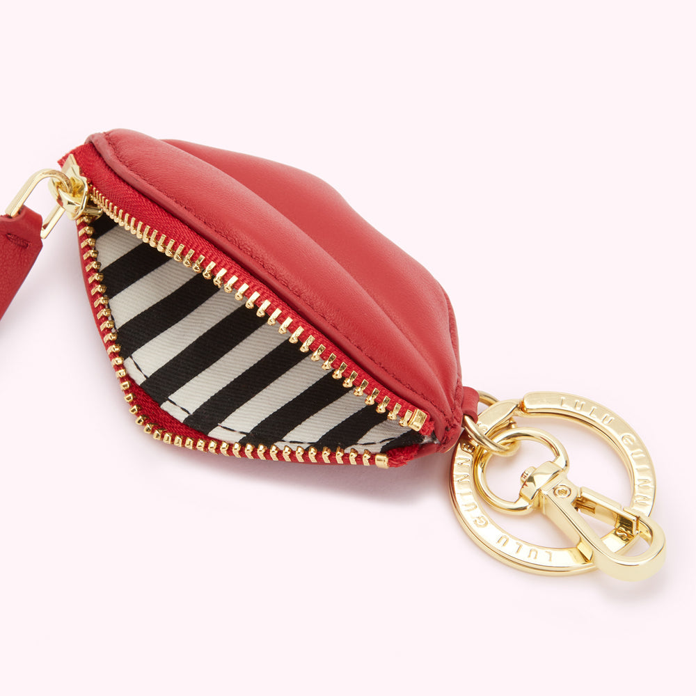 Red leather lip-shaped coin purse with gold zipper and keyring.