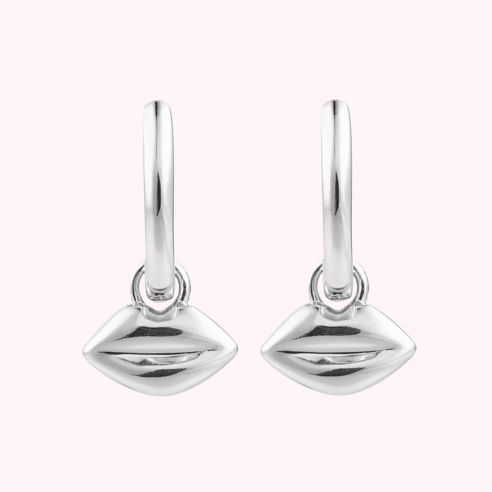 Front image of a pair or sterling silver hoop earrings with lip charms.