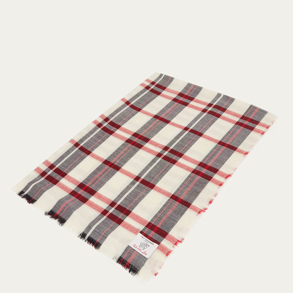 Plaid scarf with red, black and ivory tartan on a white background
