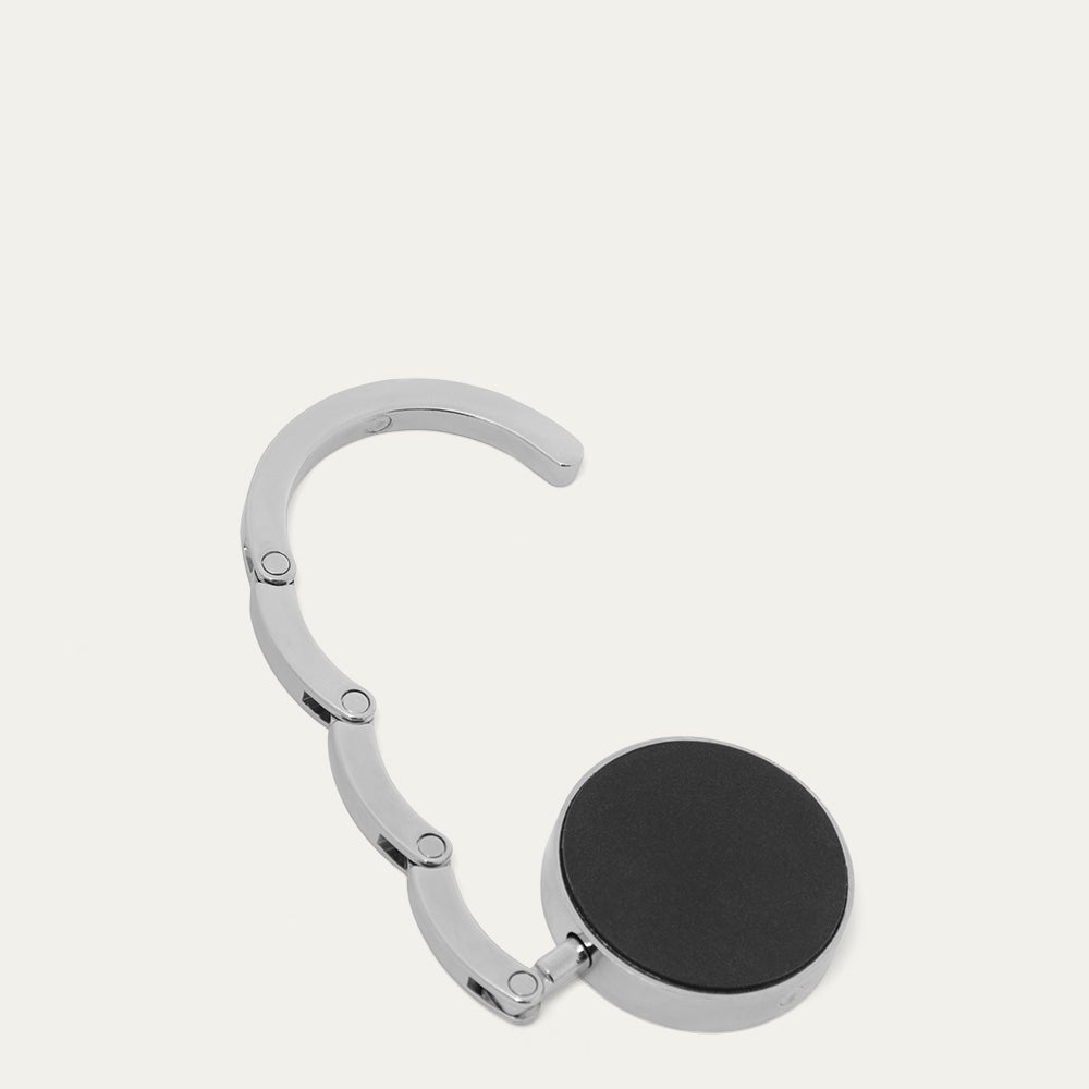 Silver handbag hook on a white background