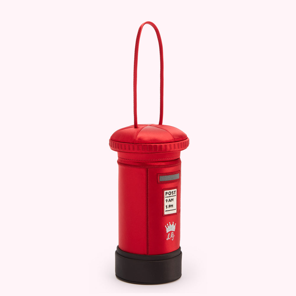 Red satin postbox-shaped handbag with black base and top, satin handle, and small crown emblem.