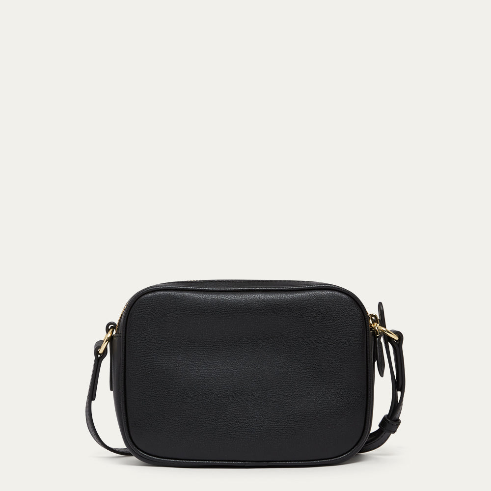 Black leather crossbody bag on a light gray background