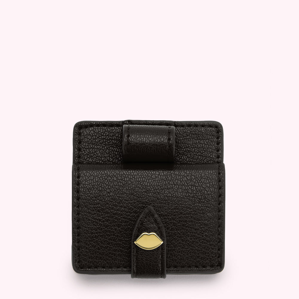 Black leatherette lip-shaped compact mirror with gold clasp.
