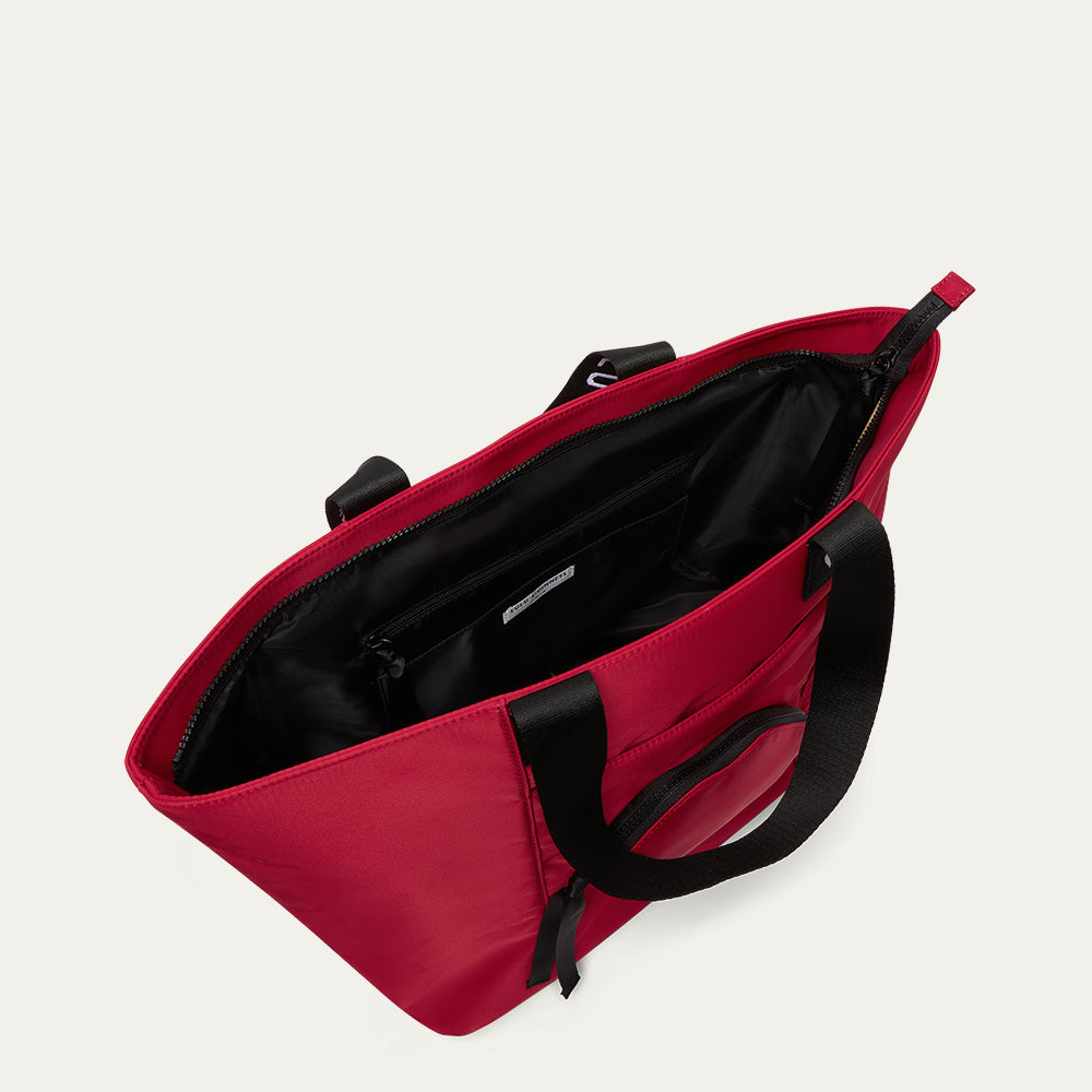 Red bag with black interior on a light gray background