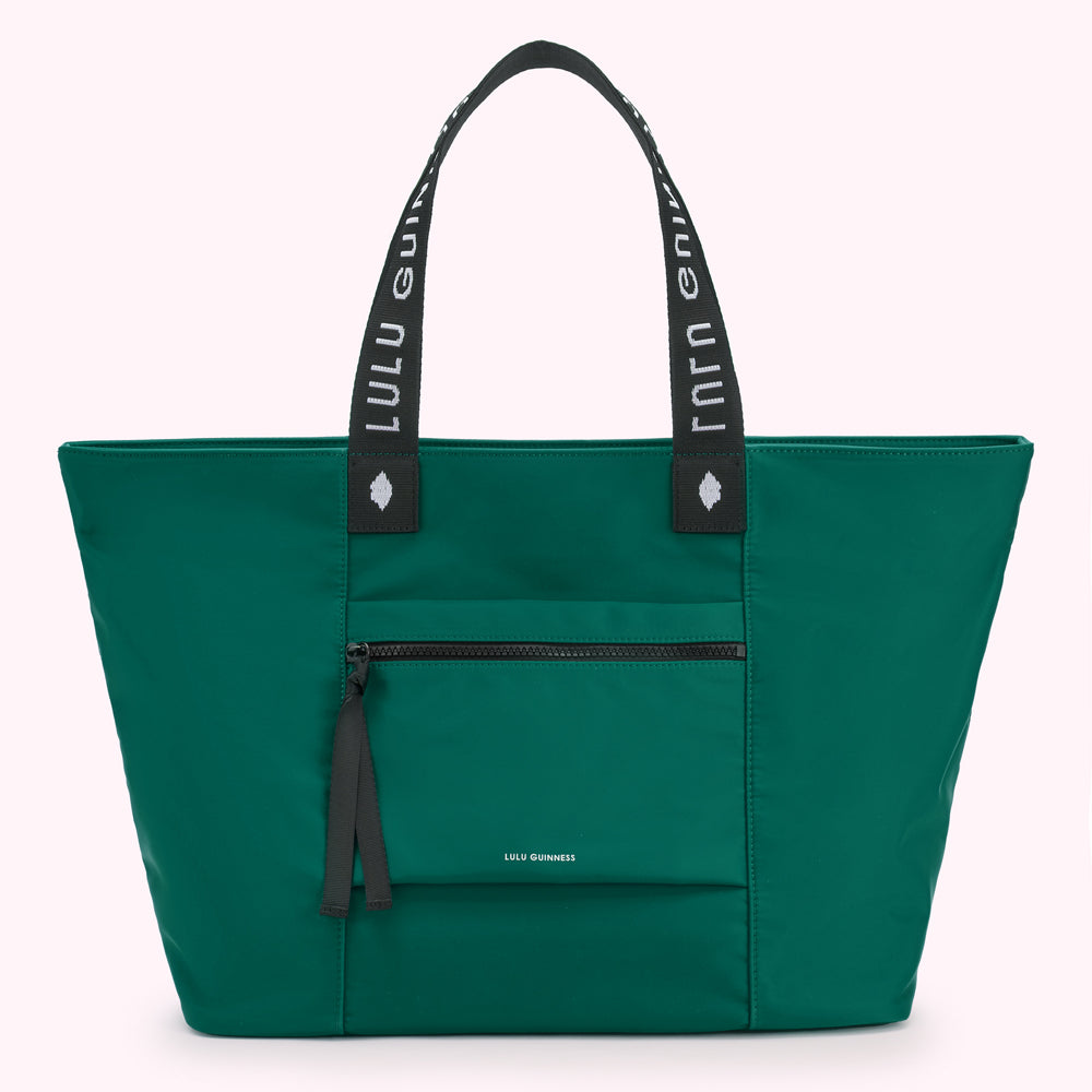 Green Lulu Guinness tote bag with white logo on straps.