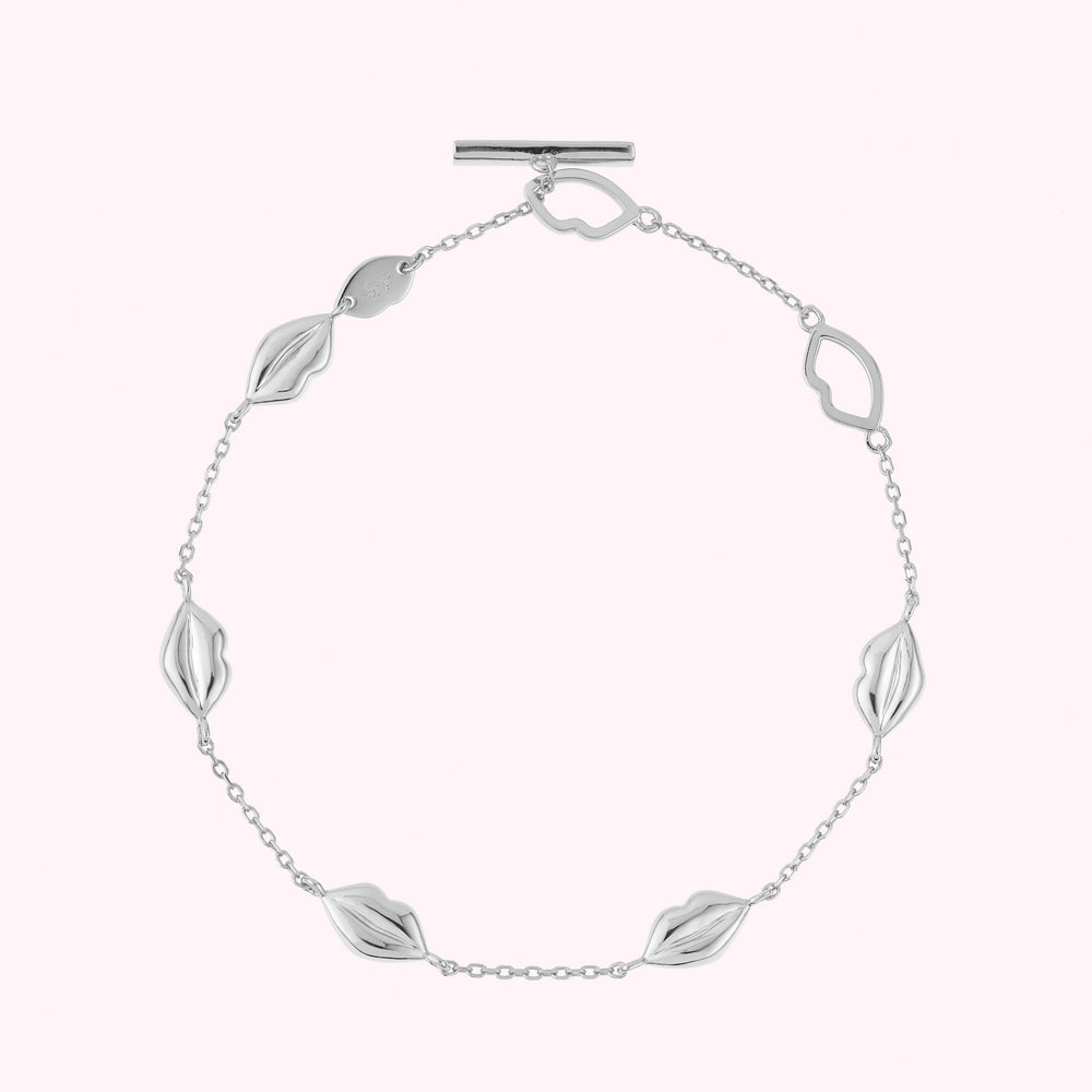 Sterling silver lip charm bracelet with lip shaped links.