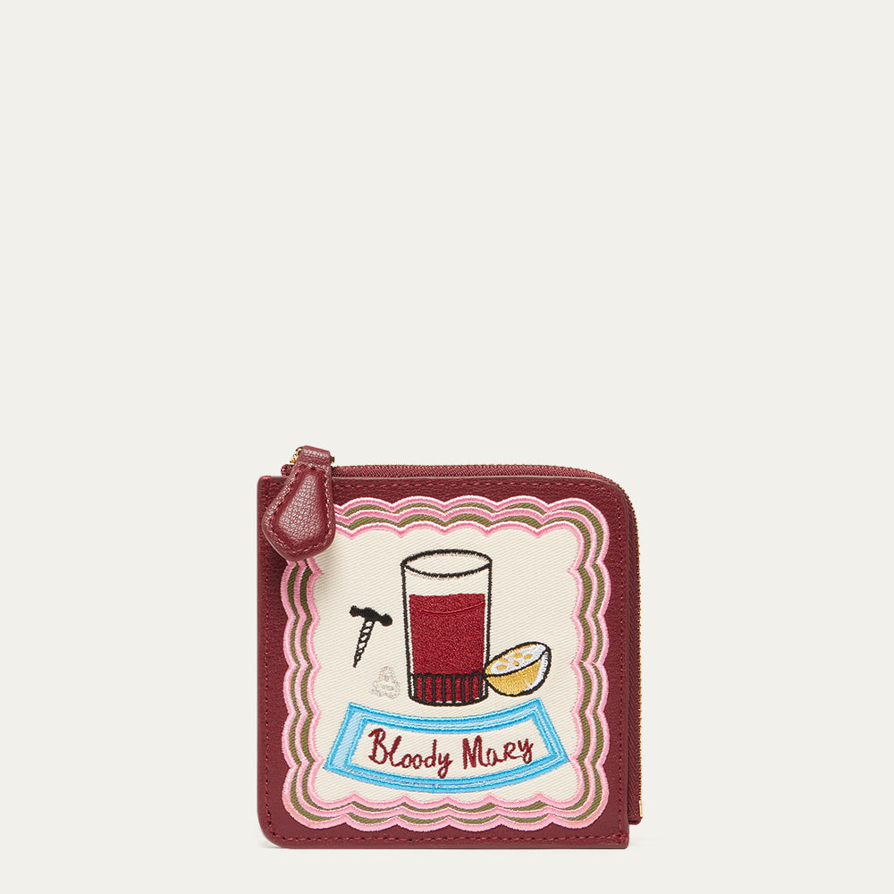 Coin purse with 'Bloody Mary' cocktail design on a white background