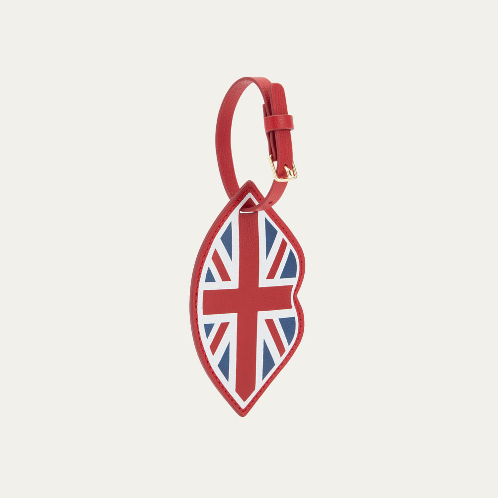 Red leather luggage tag with Union Jack design on a light gray background
