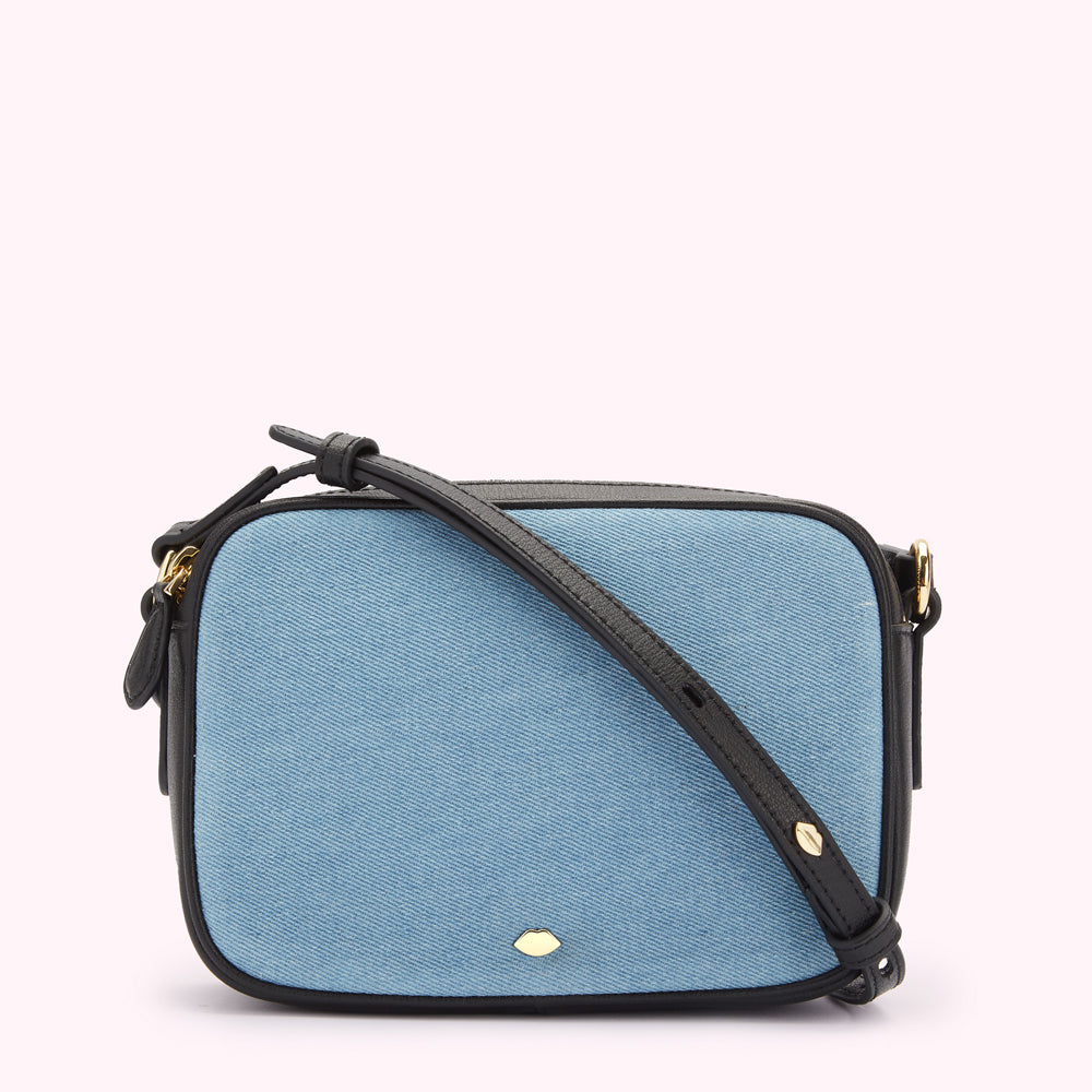 Light blue denim crossbody bag with black leather trim and strap.
