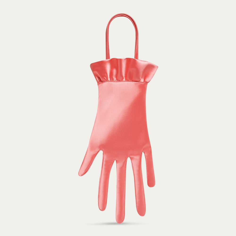 Pink satin hand-shaped bag on a light gray background