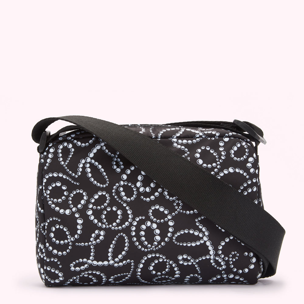 Black crossbody bag with a white pearl pattern.