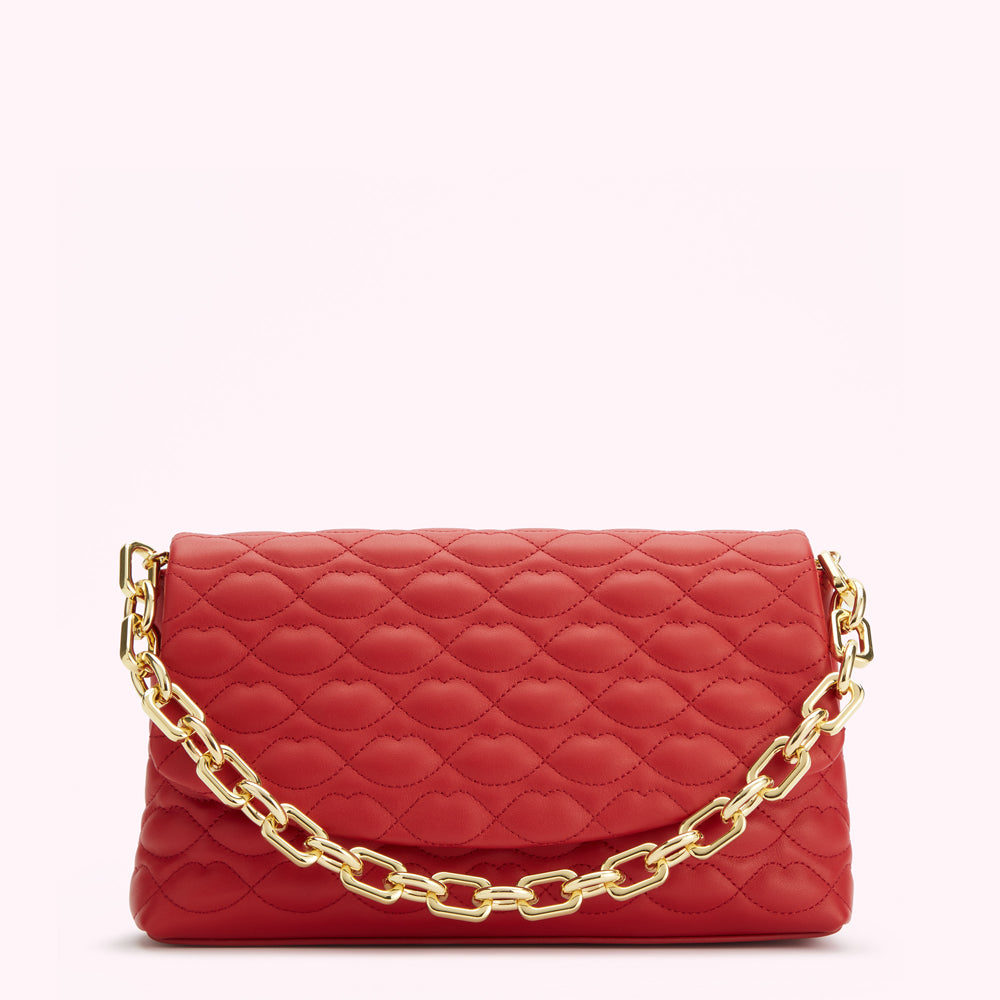 Red quilted crossbody bag with gold chain strap.
