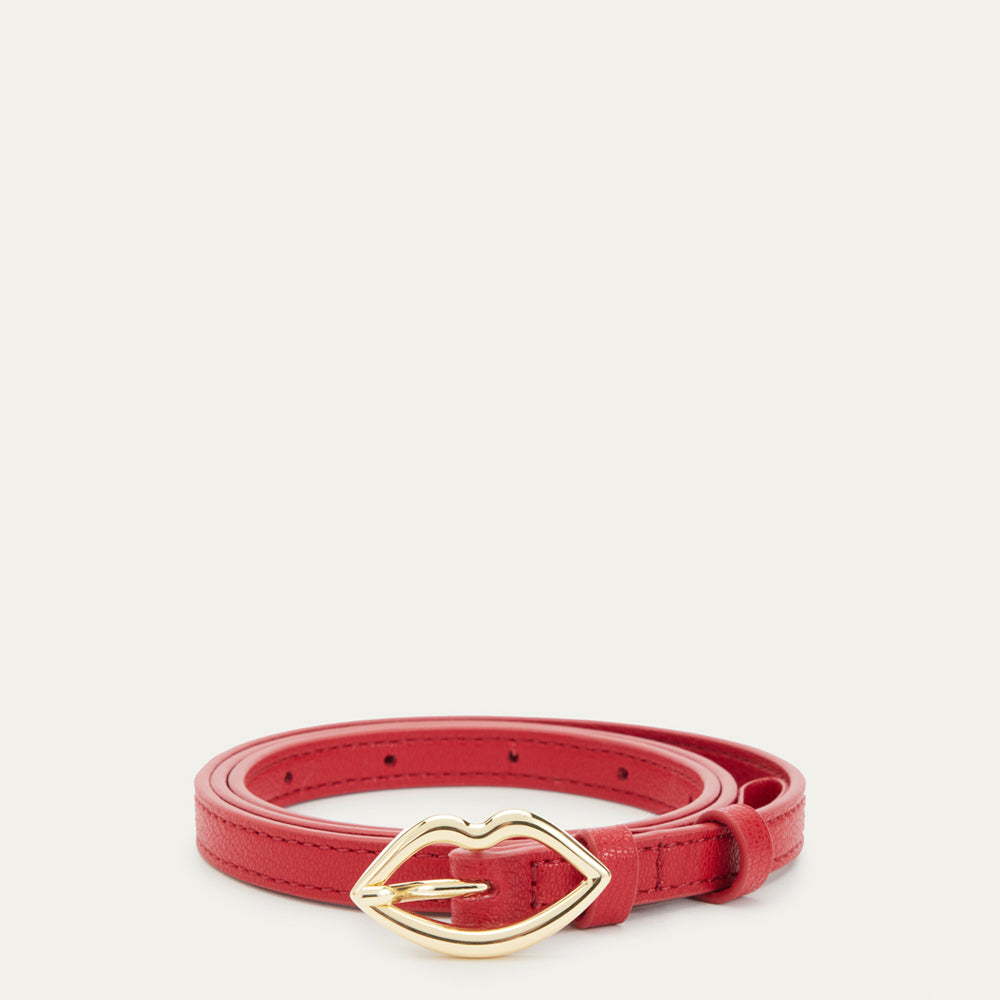 A red leather belt with a gold lip-shaped buckle, on a white background.
