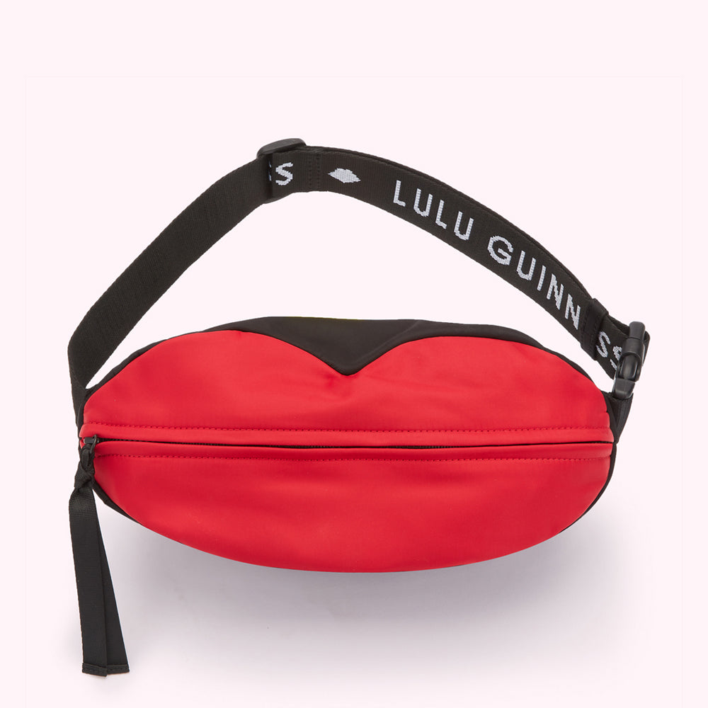 Red and black Lulu Guinness lip-shaped bum bag with adjustable strap.
