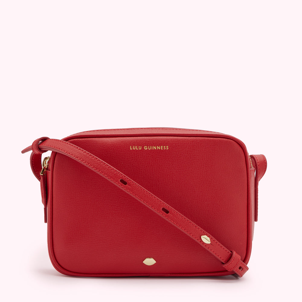 Red Lulu Guinness crossbody bag with gold-toned hardware.
