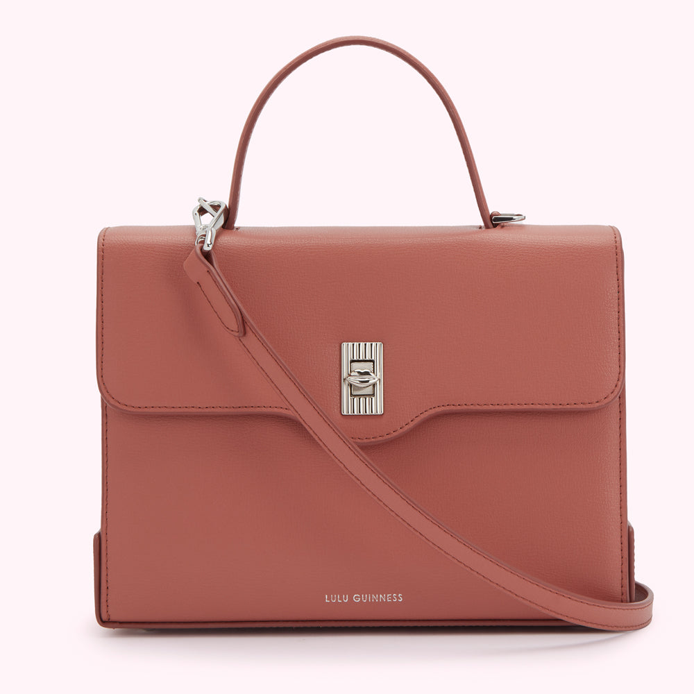 Dusty rose Lulu Guinness leather satchel with silver-toned hardware and detachable shoulder strap.
