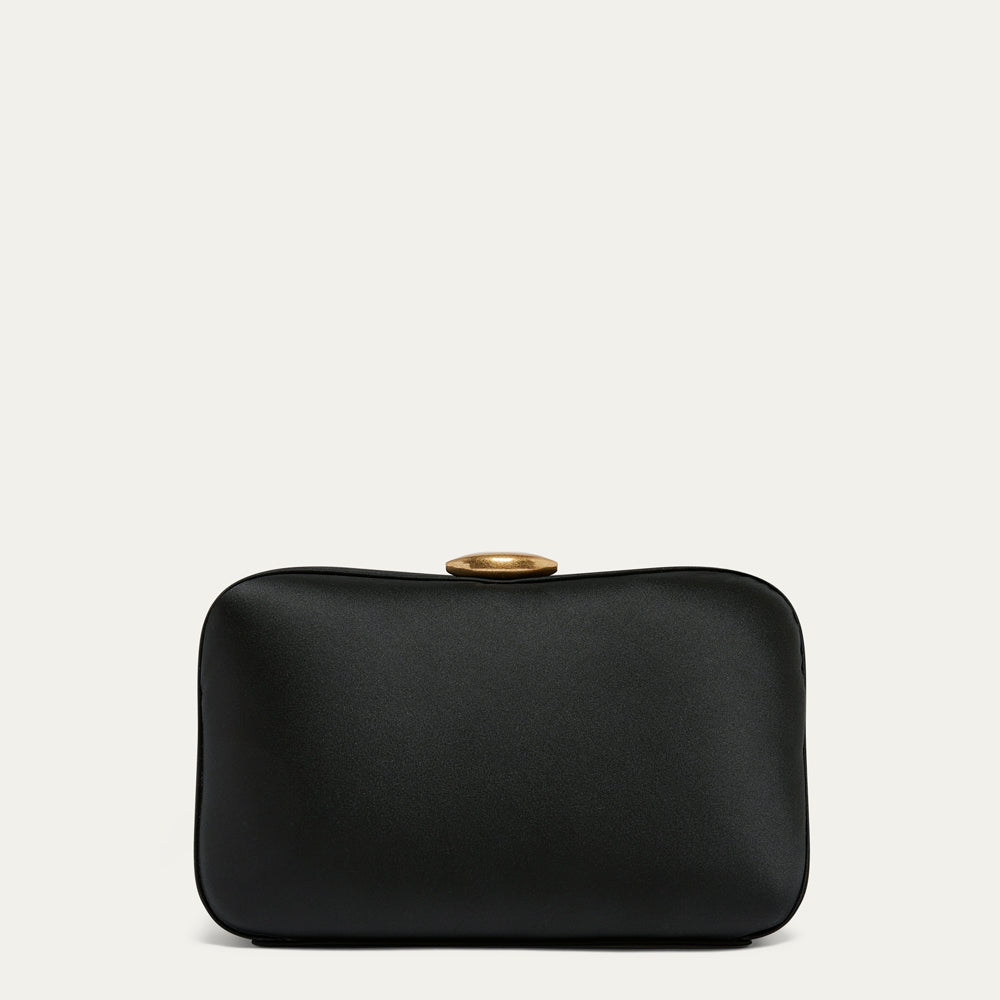 Black satin clutch bag with lip shaped closure on a white background.