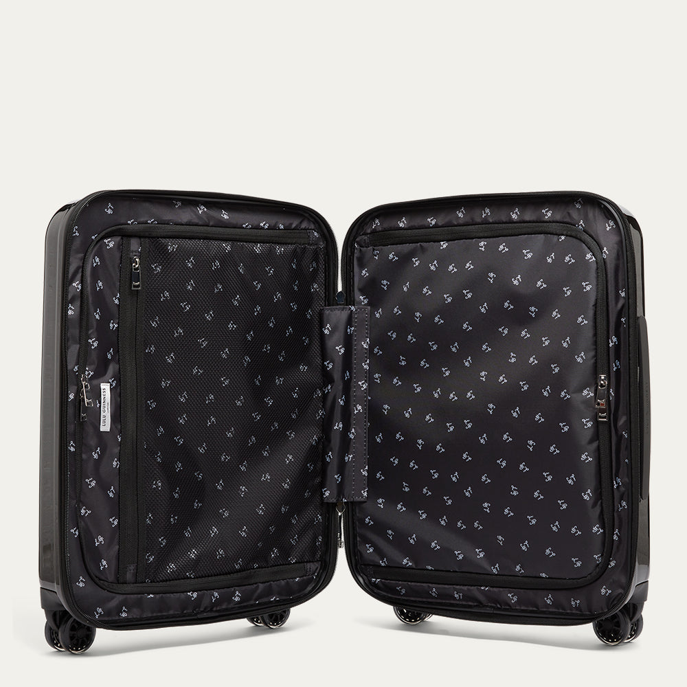 Black suitcase open reveling a L.G. printed linining on a white background.