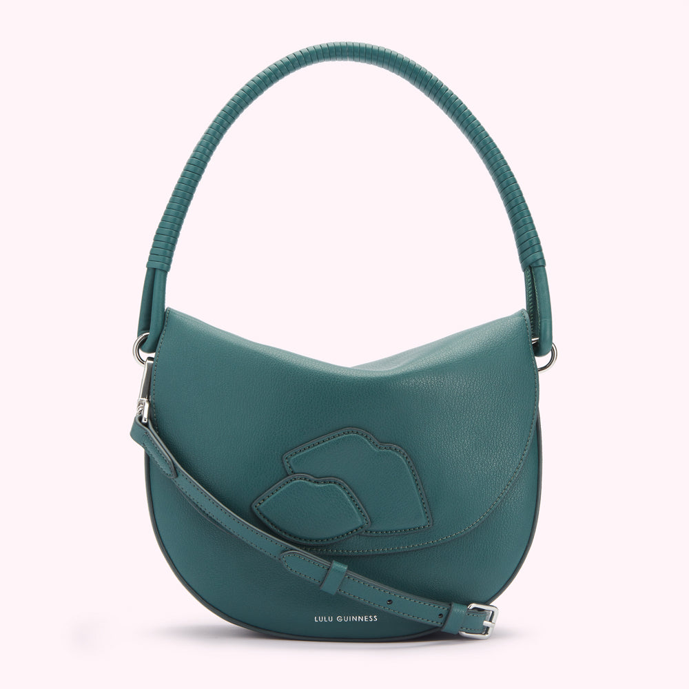 Teal Lulu Guinness crescent bag with a braided top handle and three lips detail.
