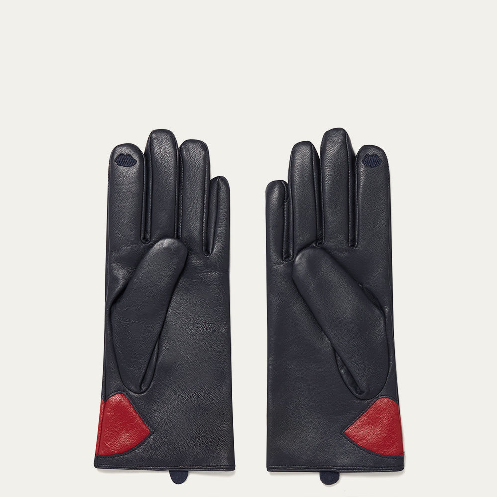 Pair of navy leather gloves with red accents on a light gray background