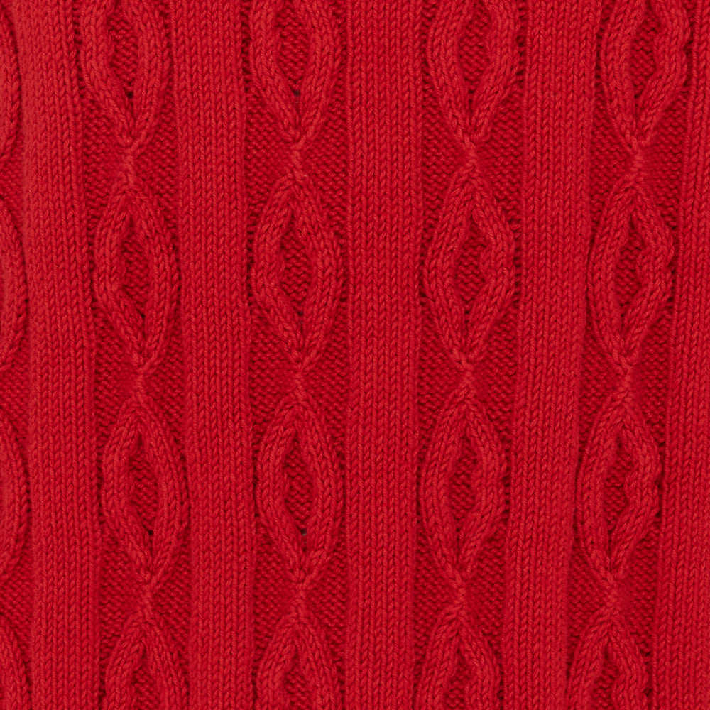 Close-up of red cable knit jumper