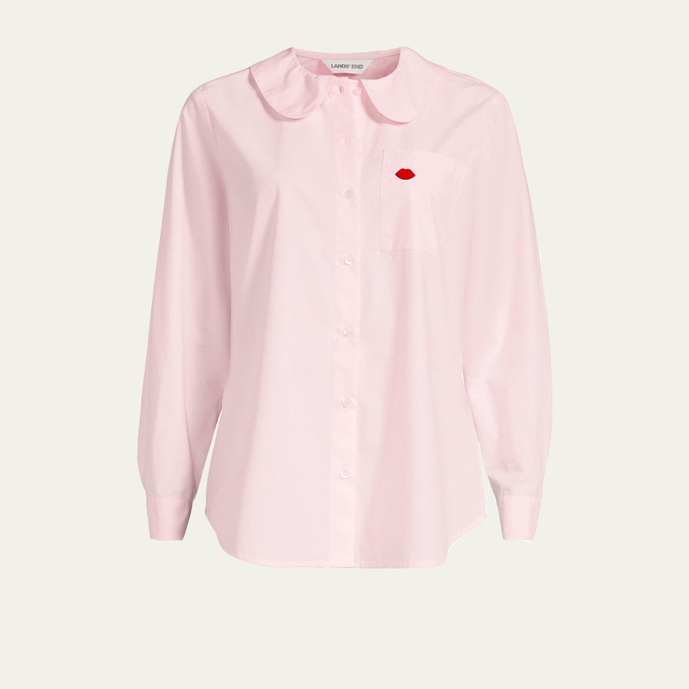 Pink shirt with a red embroidered lip emblem on a light gray background