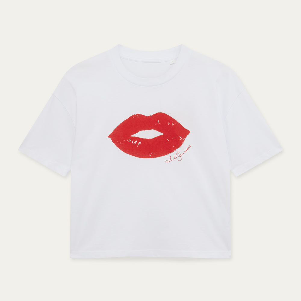 White t-shirt with red lips graphic and text on a light gray background