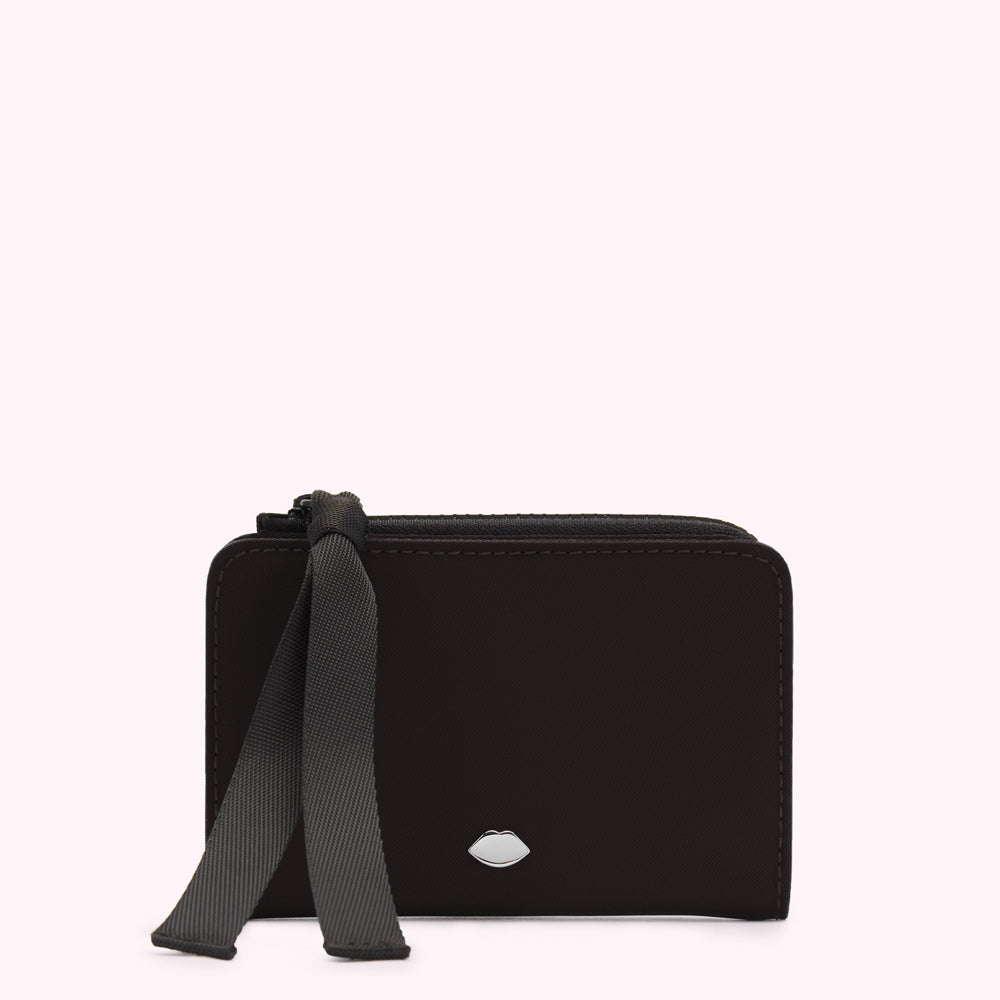 Black zippered wallet with a black ribbon accent and silver lip logo on a white background.