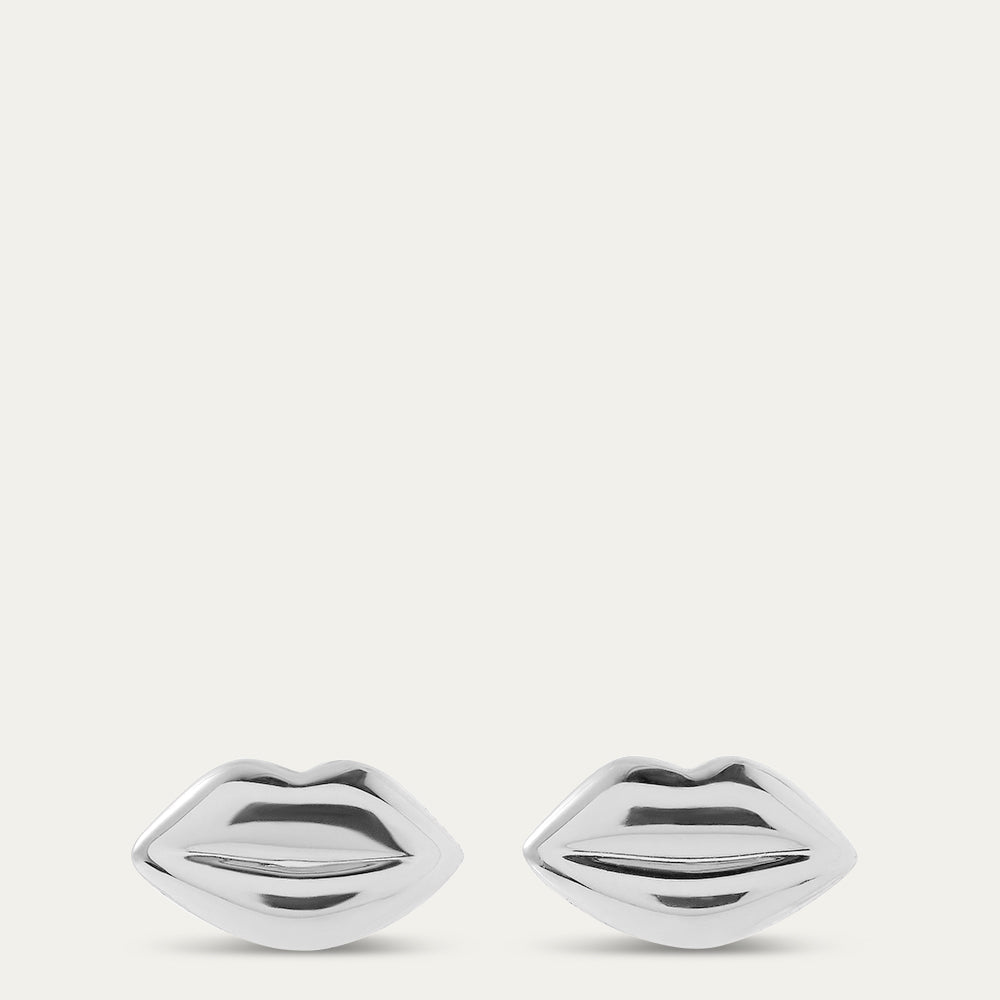 Silver lip-shaped earrings on a white background