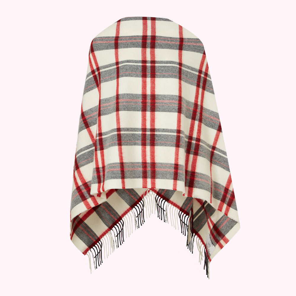 Cream, red, and grey plaid or tartan poncho with fringe.