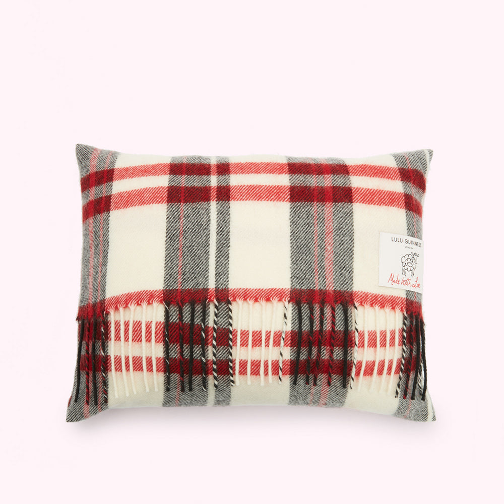 Rectangular cream, red, and grey plaid or tartan cushion with fringe.