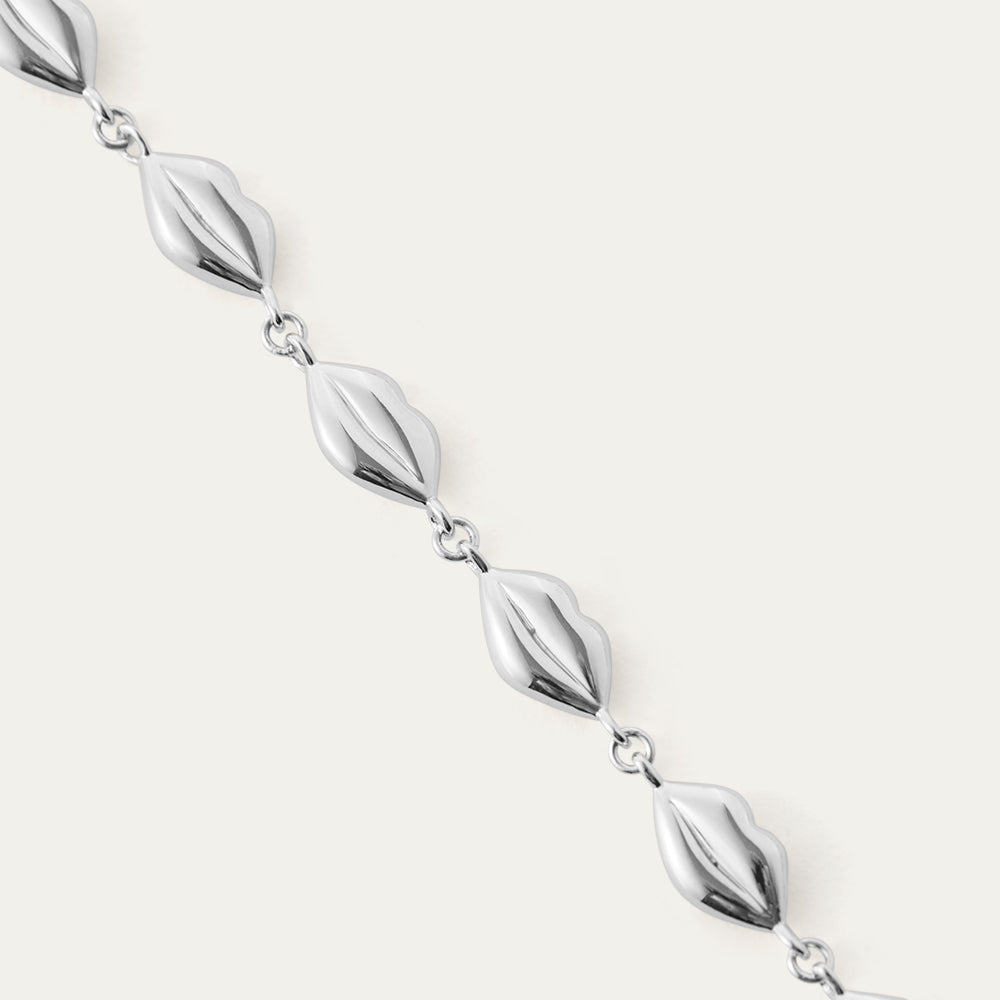 Silver lip chain necklace on a white background