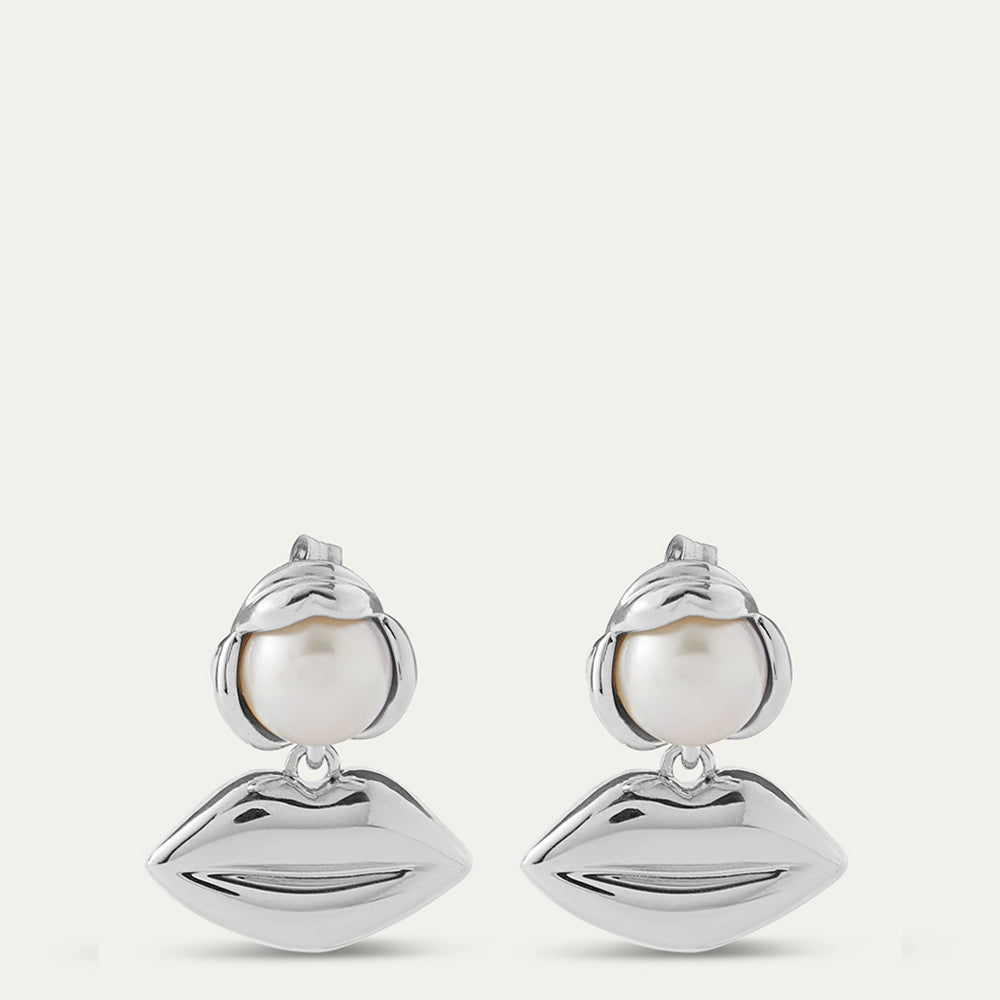 Silver lip pendant drop earrings with pearls on a white background