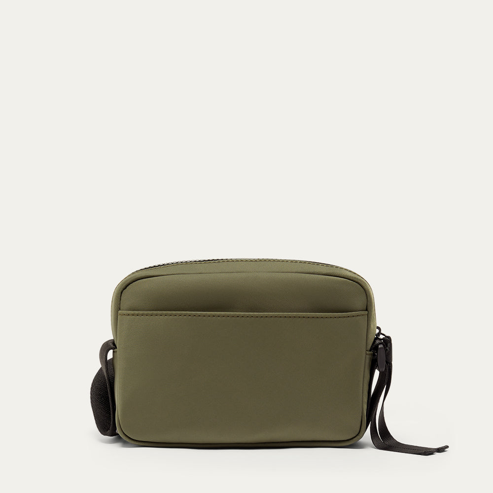 Green nylon crossbody bag on a white background