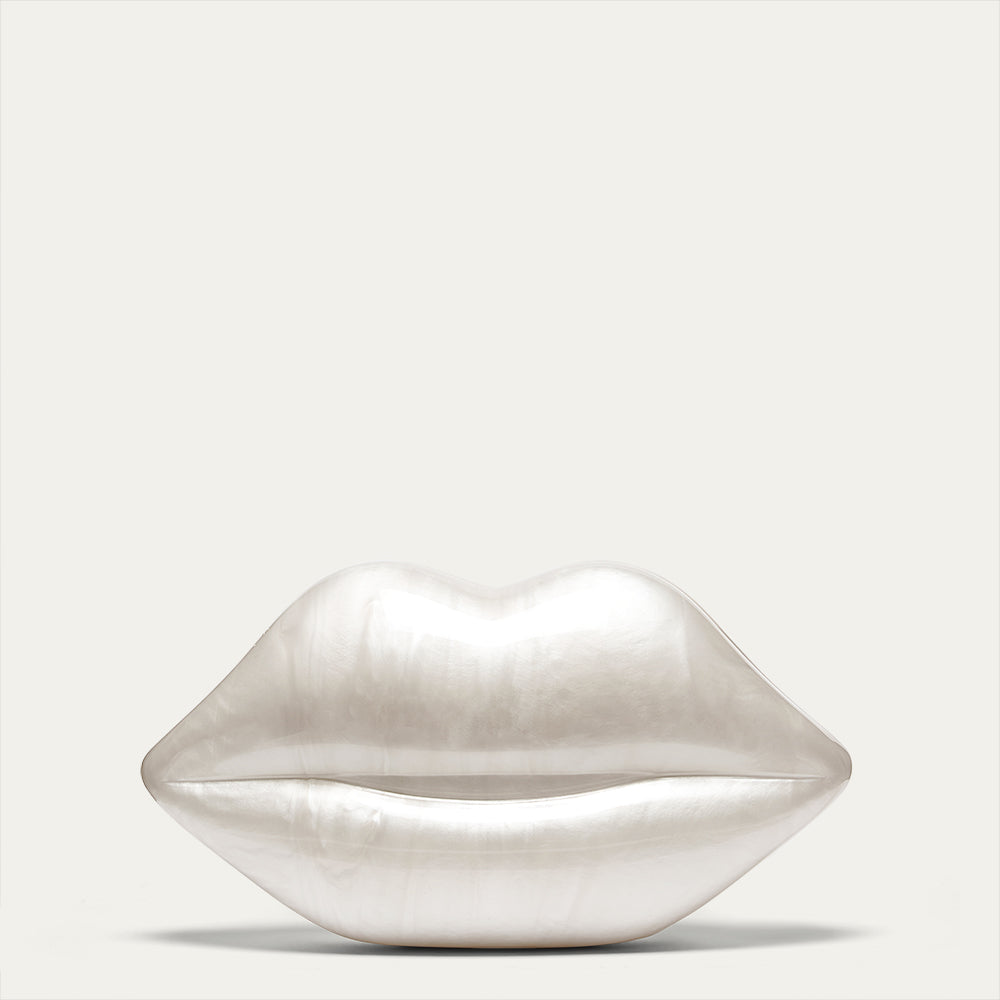Ivory pearl lip-shaped clutch bag on a light gray background